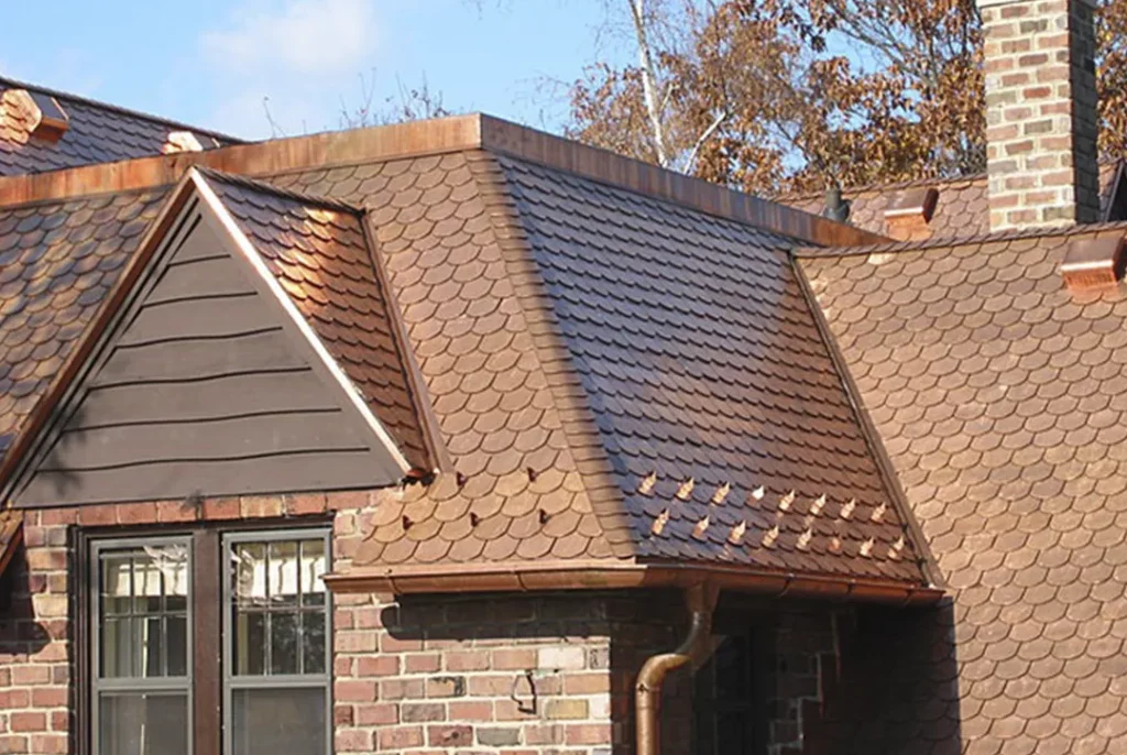 Beautiful custom copper roofing on a brick home, showcasing expert craftsmanship and durable materials for luxury and long-lasting performance in Indianapolis and surrounding areas.