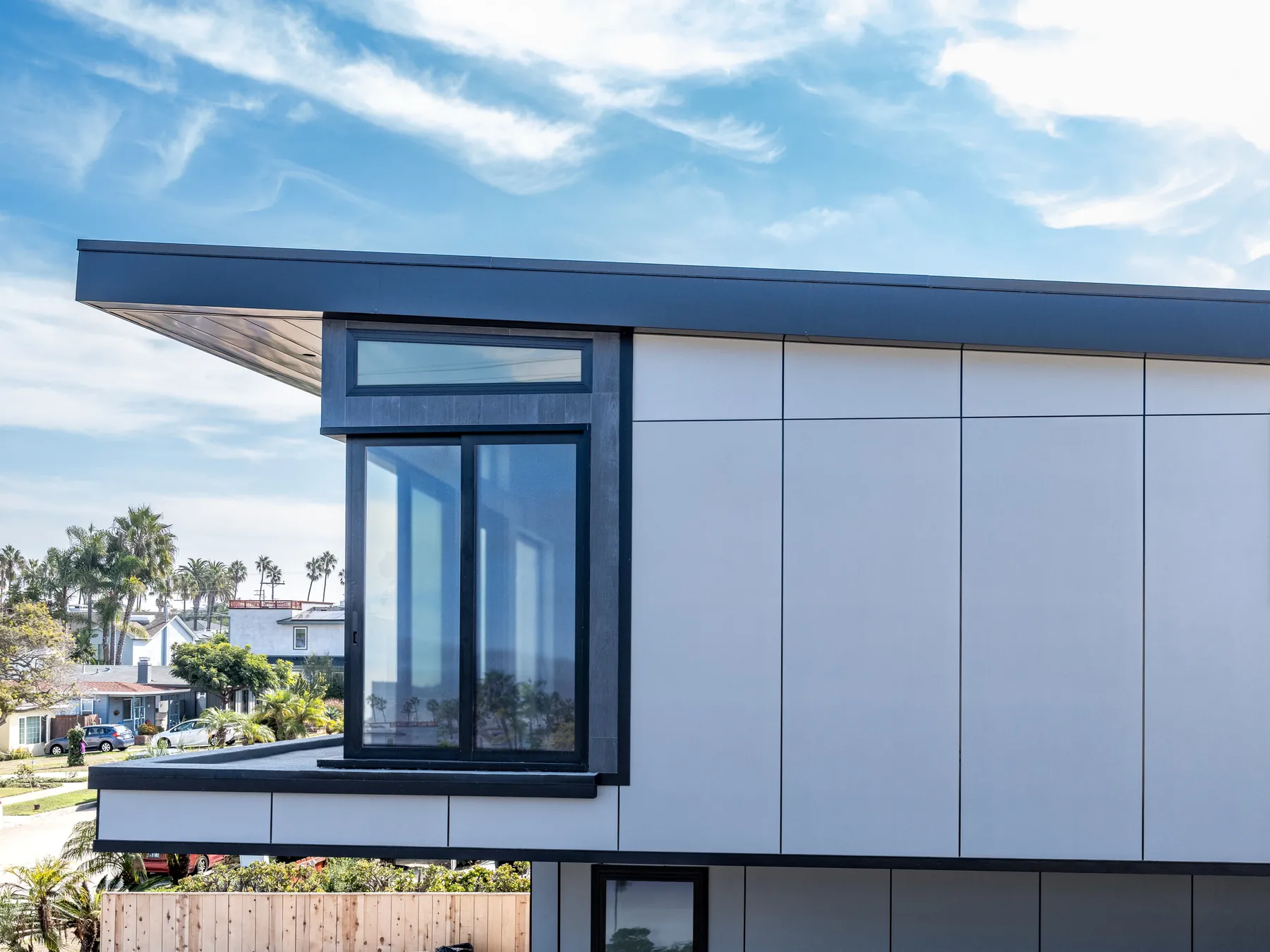 Contemporary exterior with Hardie panel styling and landscape stone accents