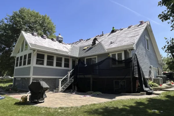 roofing-gallery-3 Roofing professionals working on a residential roof replacement, showcasing expert craftsmanship and quality materials for durable and reliable results.
