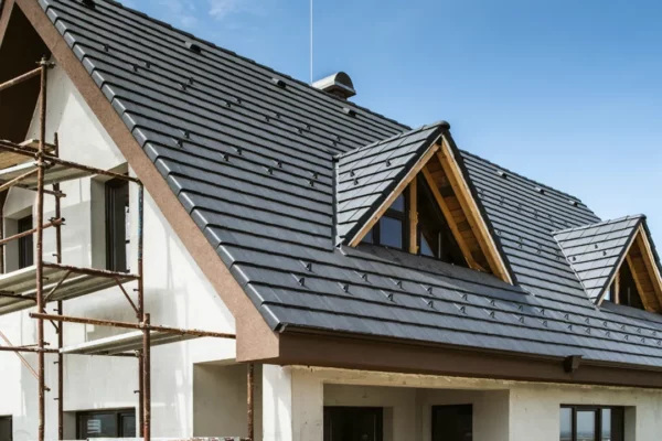 roofing-gallery-8 Modern home under construction in Indiana featuring a professionally installed metal roof, highlighting expert local roofing services designed for durability and energy efficiency in Indiana's climate.