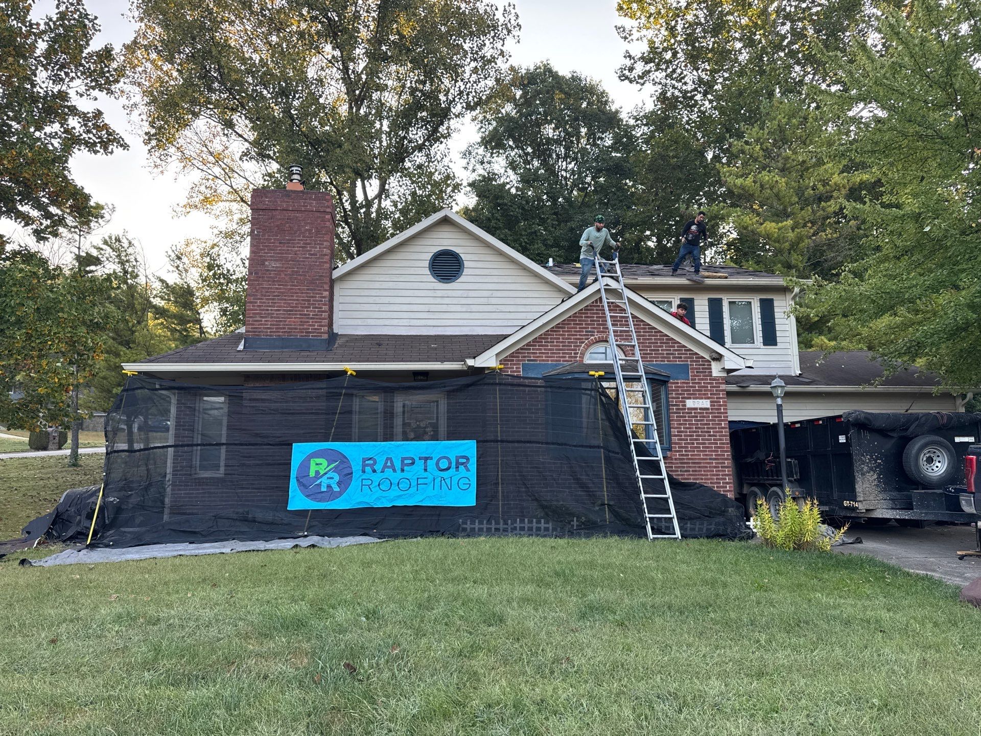 Raptor Roofing crew protecting a Central Indiana home during roof work