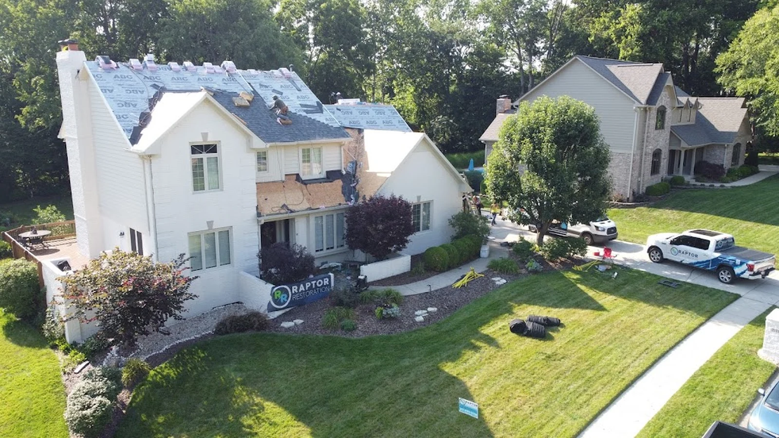 Raptor Roofing crew replacing a residential roof on a Central Indiana home