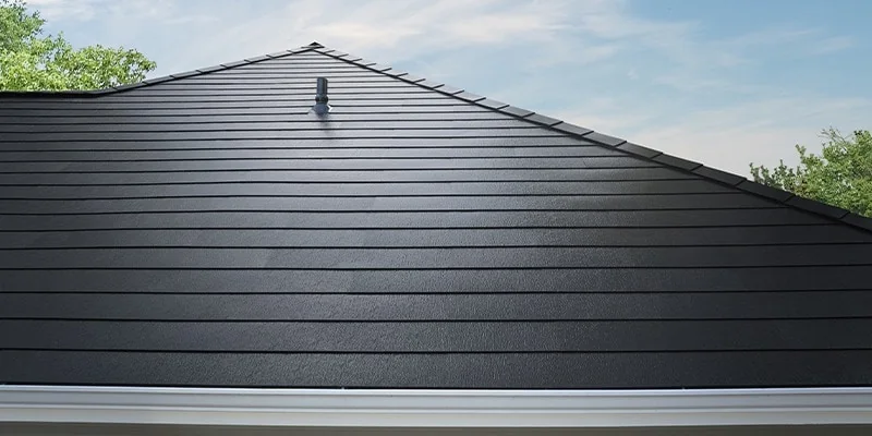 Black metal roof panel profile installed on a sloped residential roof