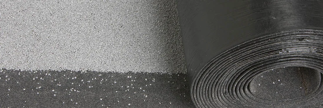 Close-up of modified bitumen SBS roof membrane roll and granulated surface