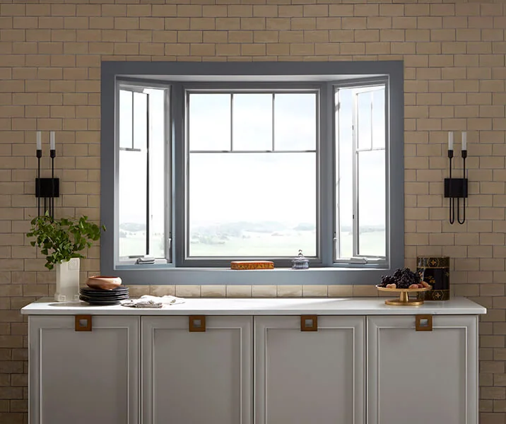 Bay window over a kitchen counter with bright natural light