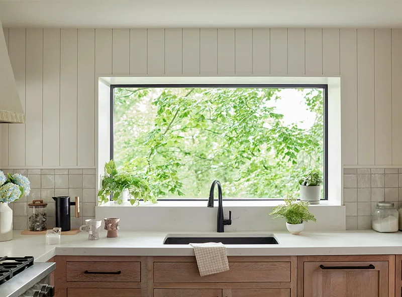 Garden-style kitchen window bringing sunlight into a Central Indiana home
