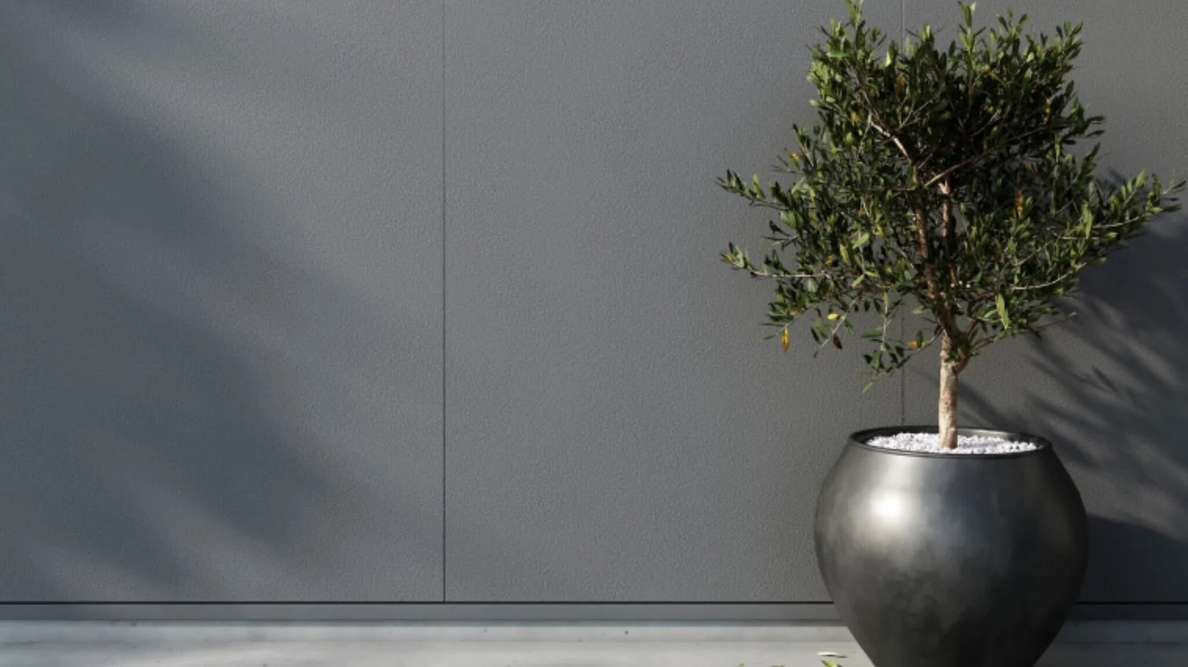 Smooth gray James Hardie architectural panel siding detail with a simple planter
