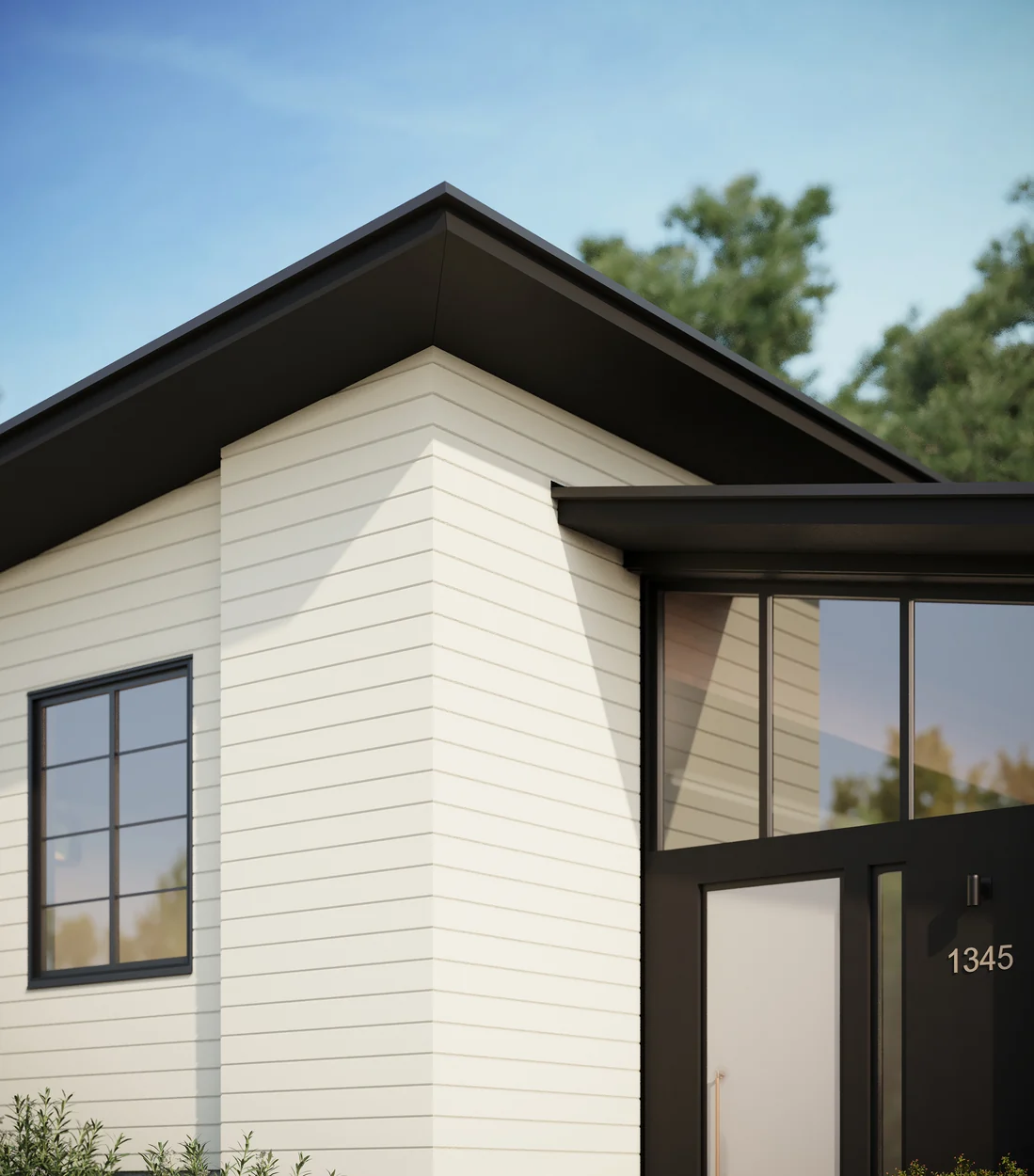 James Hardie Artisan V-groove siding on a clean home corner with leafy trees