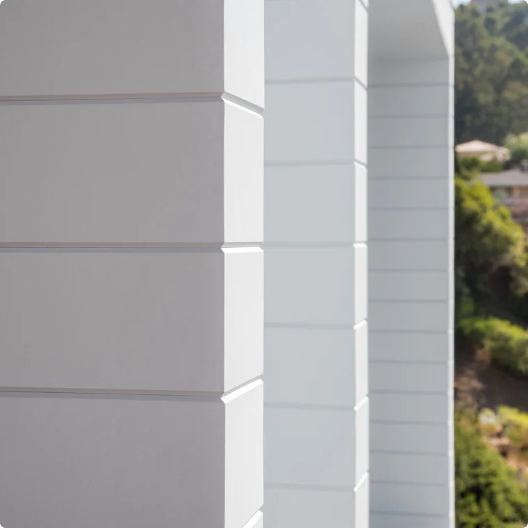 James Hardie Artisan V-groove siding detail in a white exterior finish