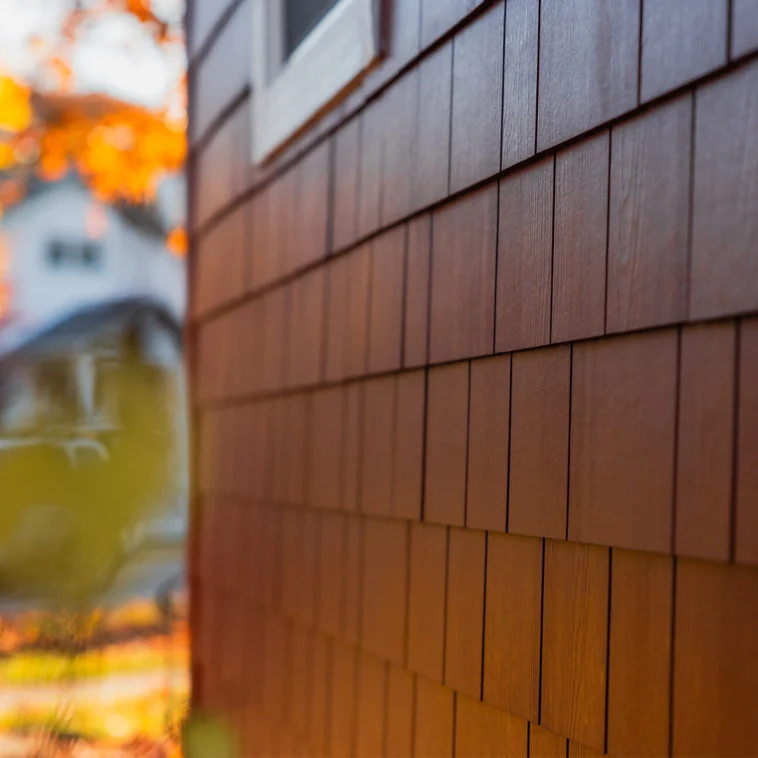 James Hardie shingle siding detail in a rich red color