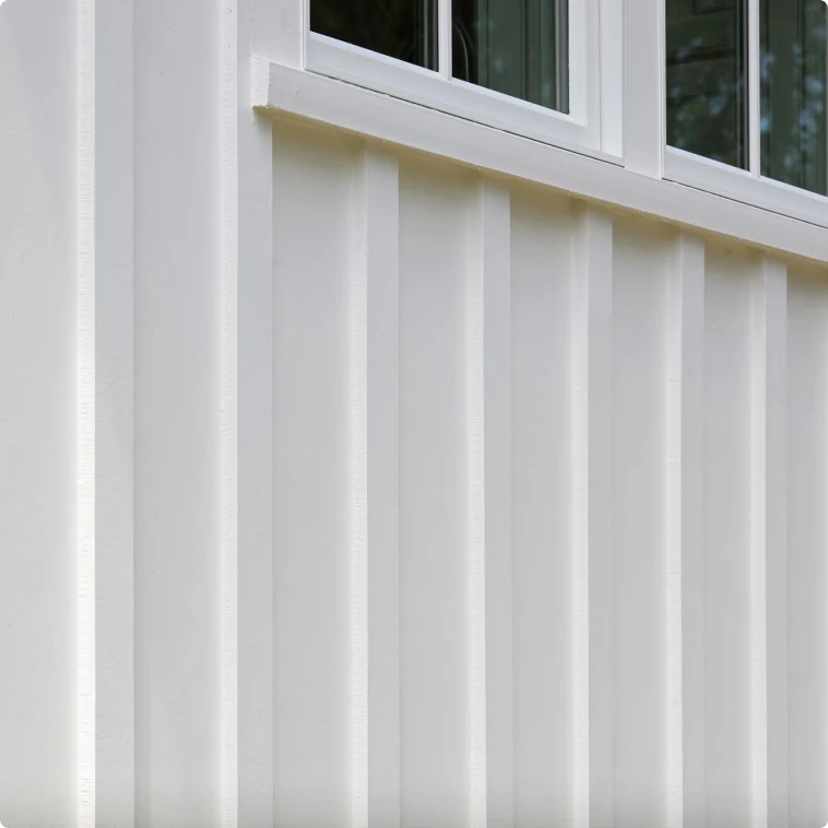 White James Hardie trim and batten detail on a clean siding installation