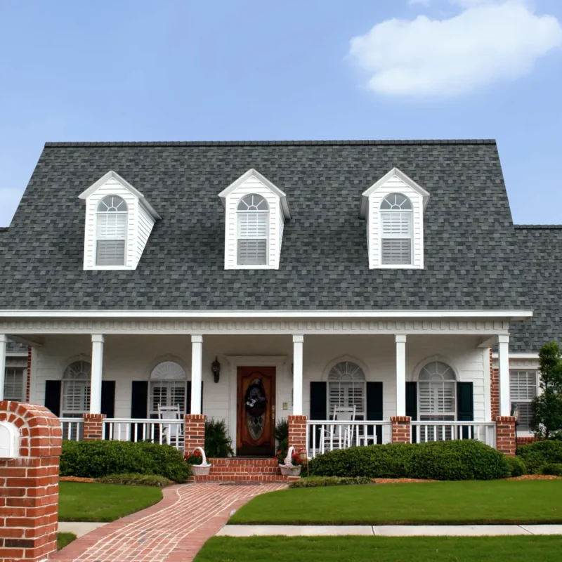 Architectural asphalt shingles on a brick and white home similar to Noblesville Indiana roofing styles