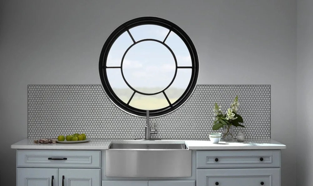 Round specialty window over a kitchen sink for a custom Indianapolis home