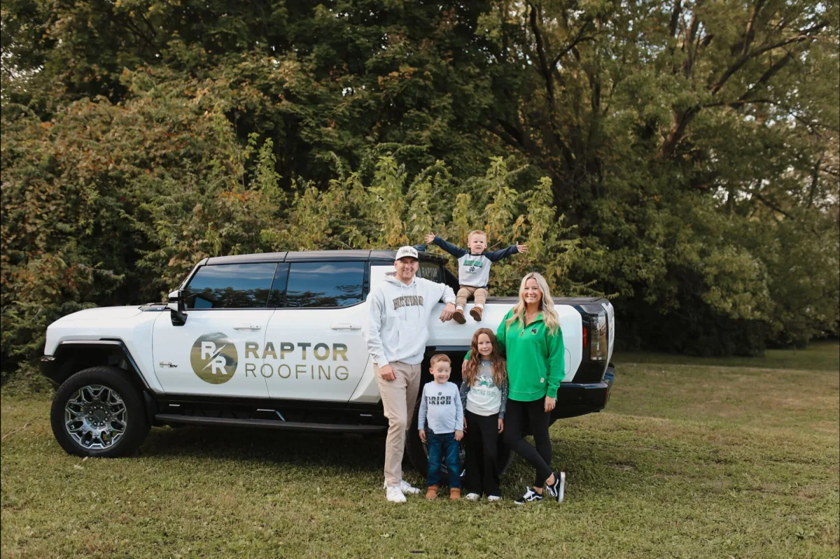 Raptor Roofing co-owner Cameron Blakely with his family beside a company truck