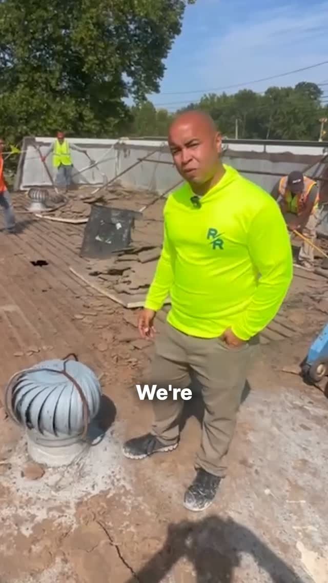 Raptor Roofing team member explaining roof ventilation on an active Central Indiana jobsite