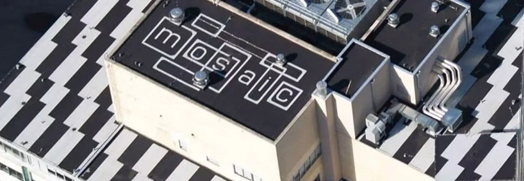 Asphaltic roof system with carefully detailed roof edges and rooftop equipment