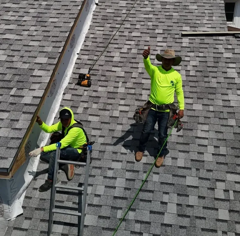Raptor Roofing crew installing shingles on a Central Indiana home.