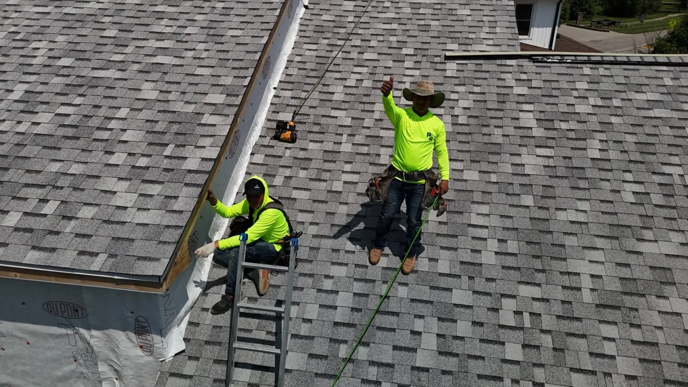 Raptor Roofing crew installing shingles on a Central Indiana home.